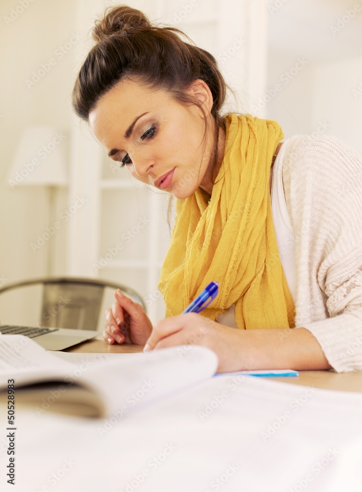 Indoor Woman Studying at Home Writing Something Indoor Woman Studying at Home Writing Something