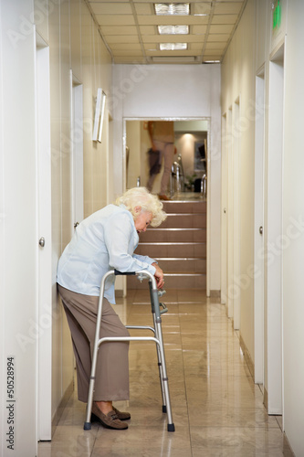 Elderly Woman Standing In Passageway