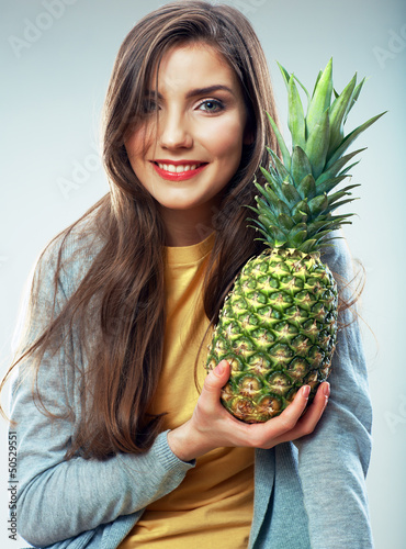 Woman hold pineapple.