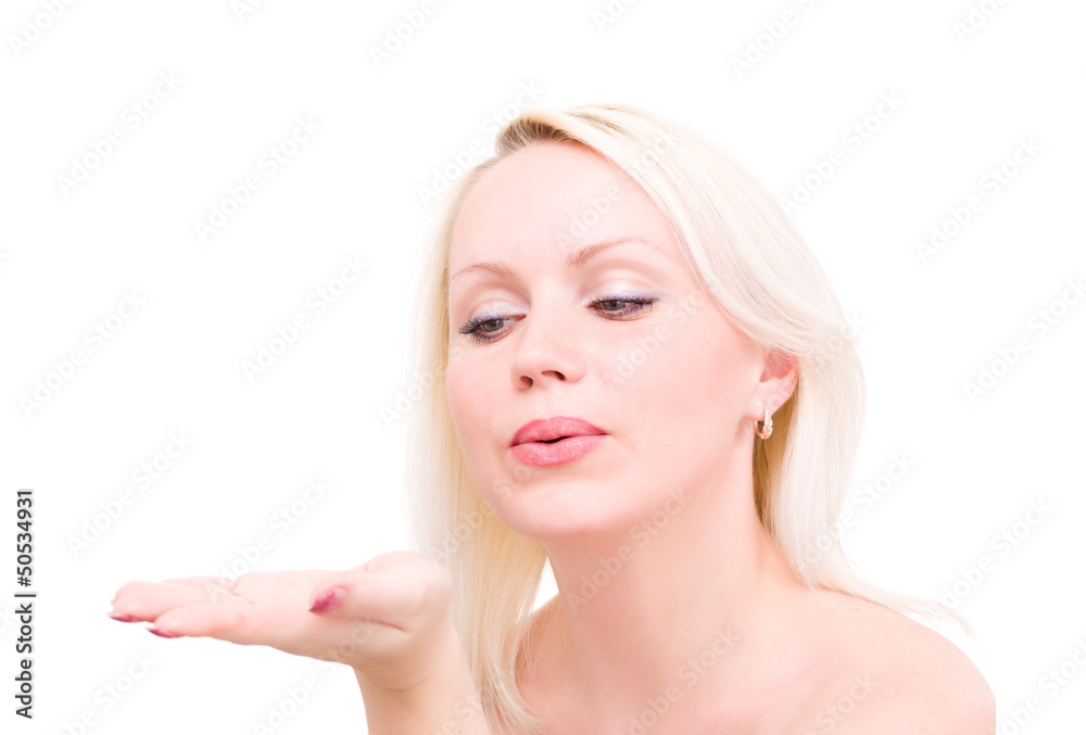 blonde woman blowing while sending an air kiss blonde woman blowing while sending an air kiss