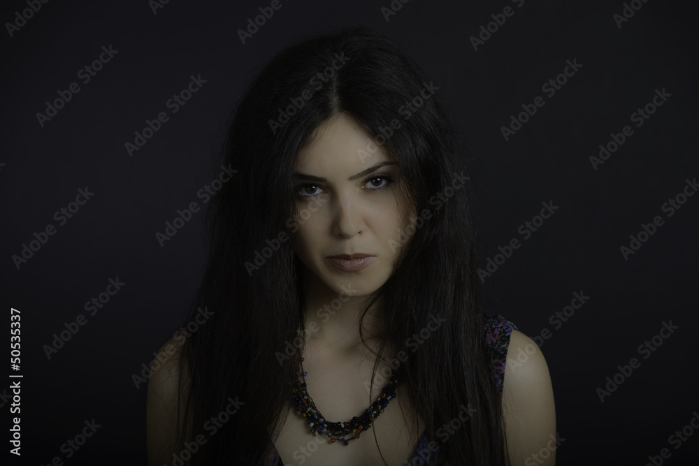 Portrait of a beautiful brunette woman. Fashion model posing at