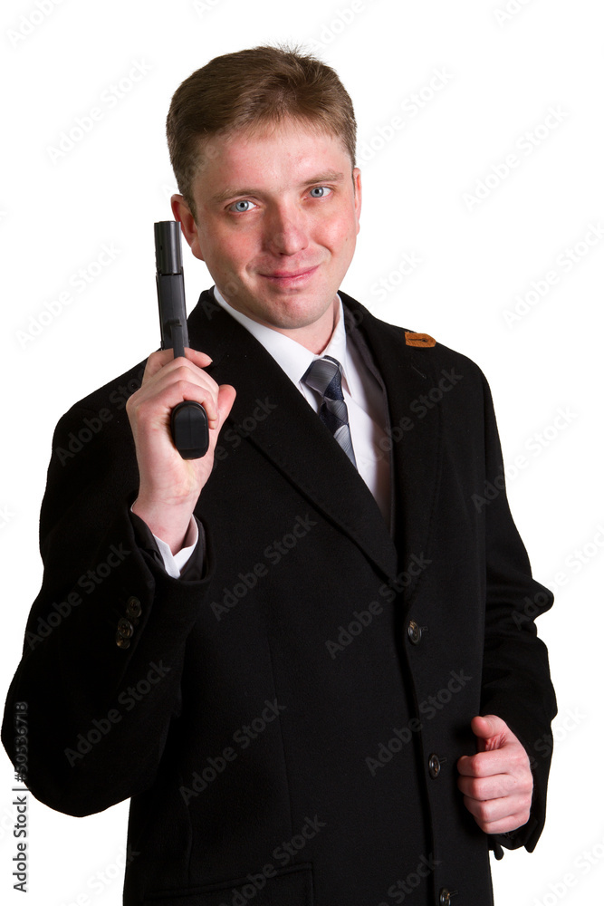 man in a suit aims from a pistol man in a suit aims from a pistol
