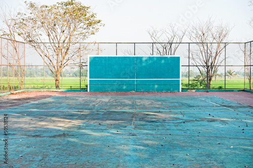 A deserted tennis court photo