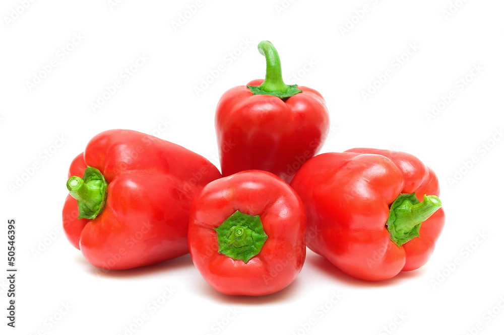 four red pepper close up on white background four red pepper close up on white background