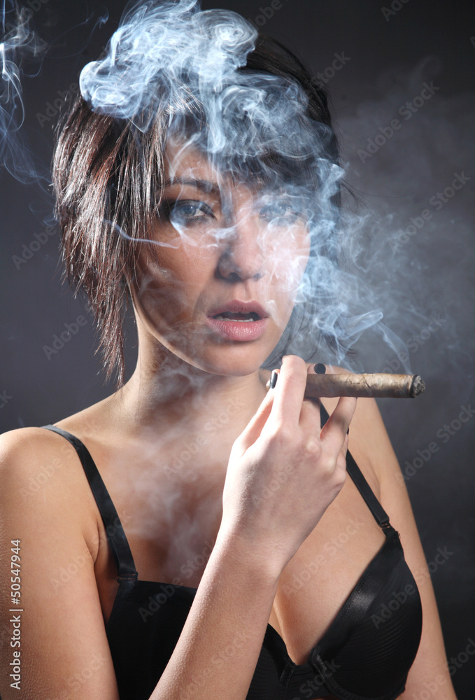 Hot sexy woman with bra smoking cigar