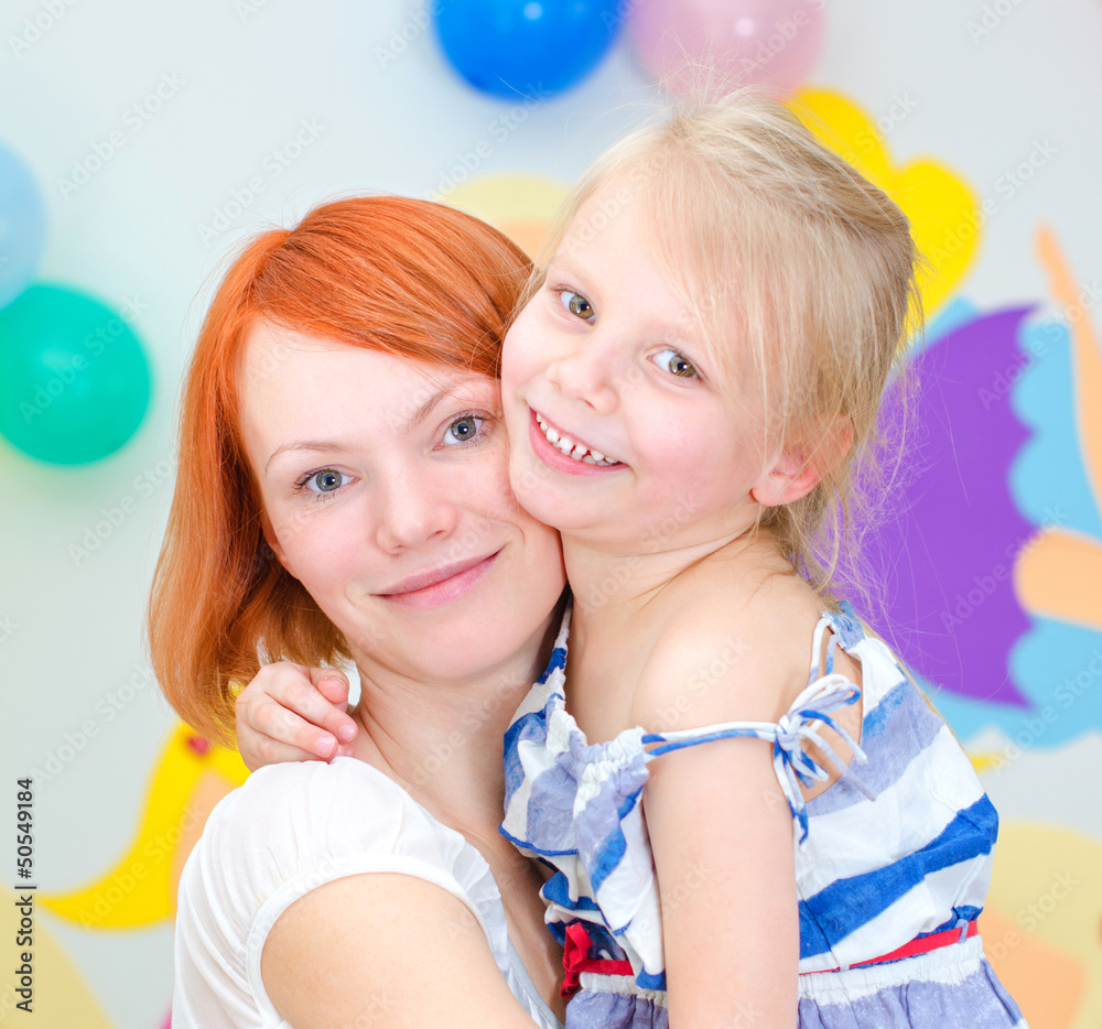Happy mother with her smiling daughter Happy mother with her smiling daughter
