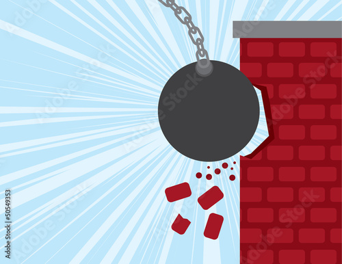 Wrecking ball smashing into a brick building