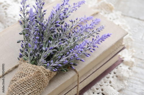 Bunch of lavender placed on book bundle photo