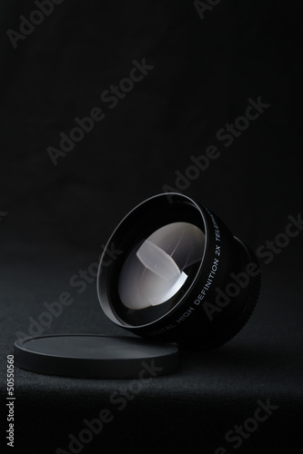 Camera lens close up on black background