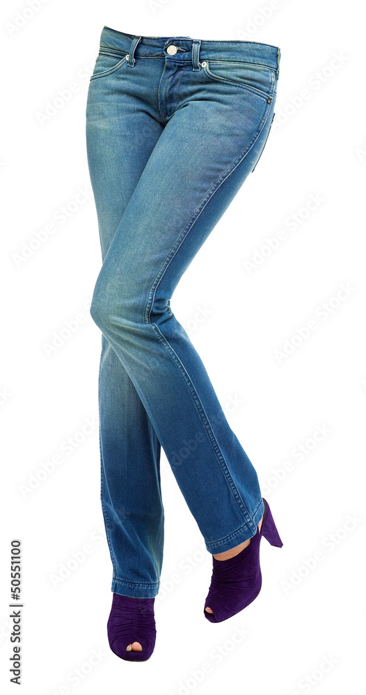 Young woman crossed legs with clear blue jeans and purple peep t Young woman crossed legs with clear blue jeans and purple peep t
