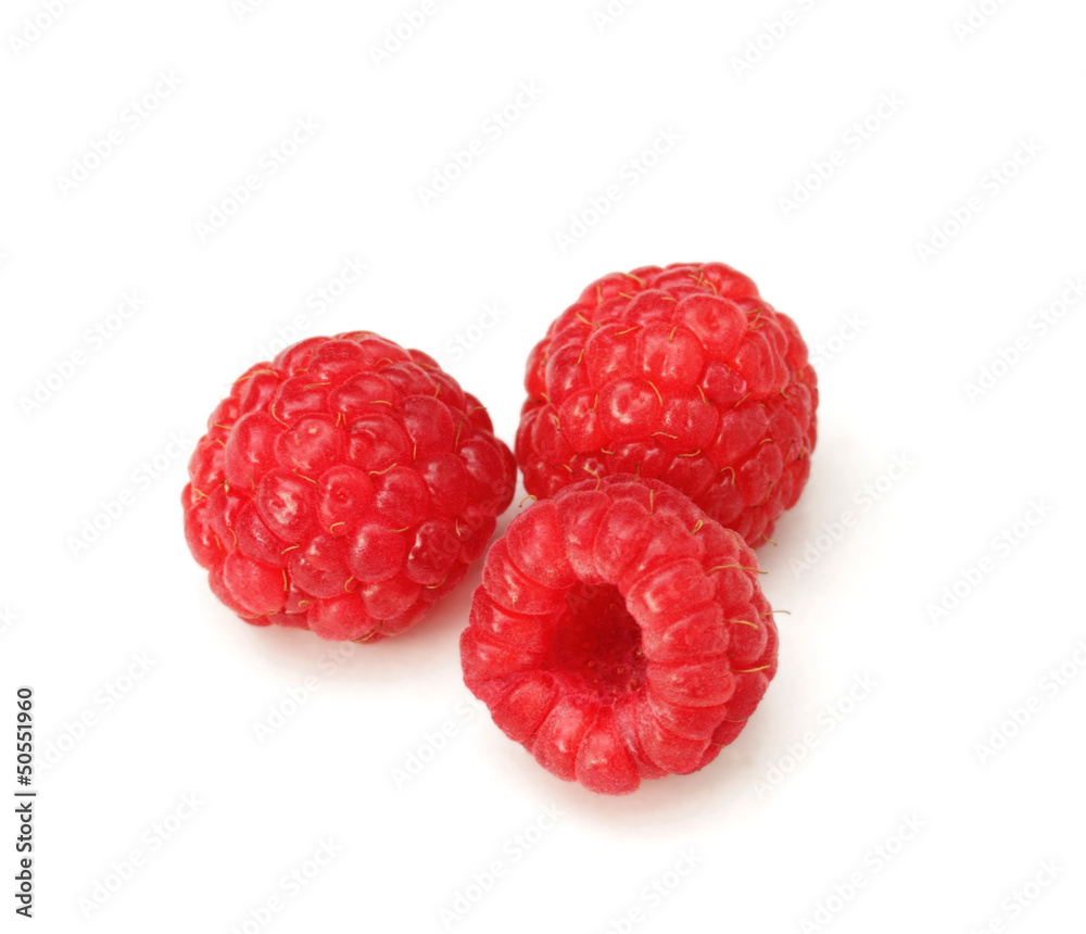 three ripe raspberries on white background three ripe raspberries on white background