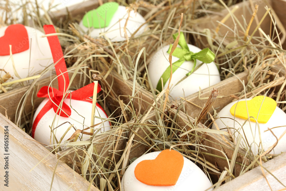 Decorative Easter eggs in wooden basket close up Decorative Easter eggs in wooden basket close up