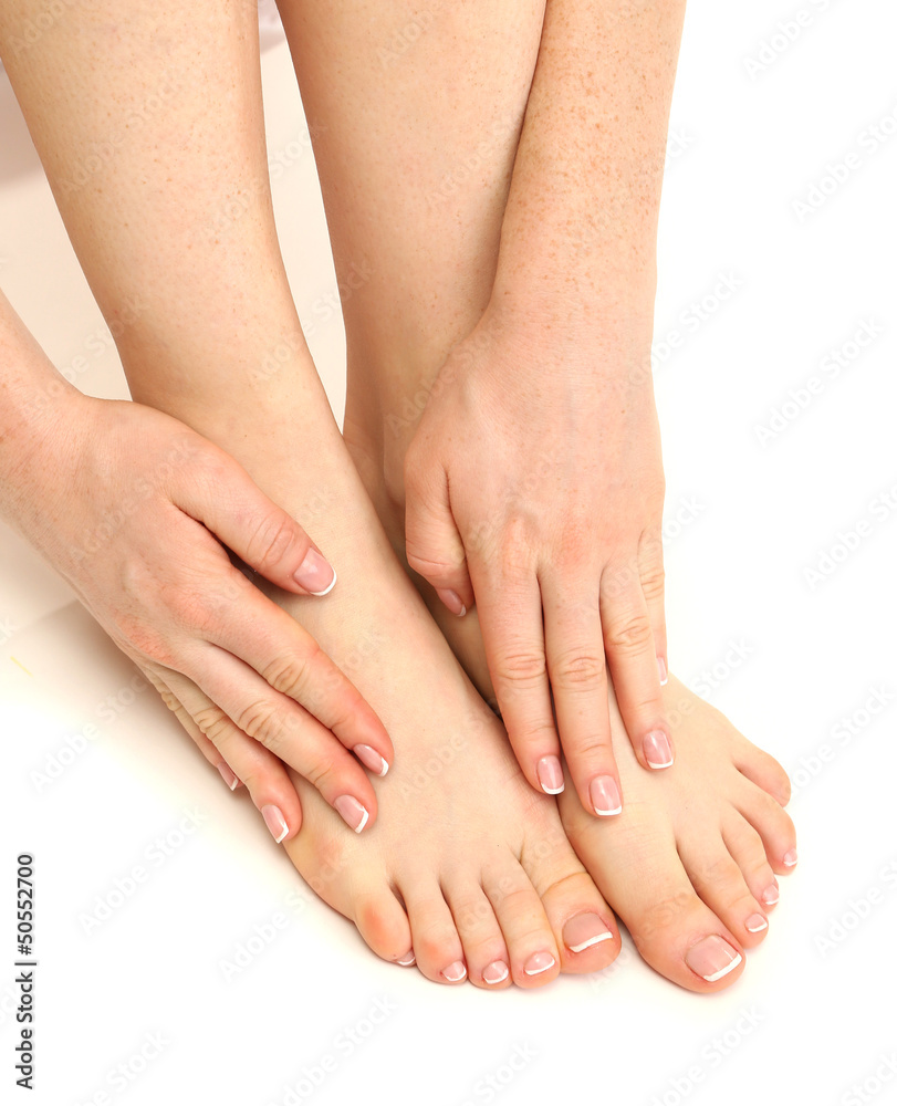Beautiful woman legs and hands, isolated on white