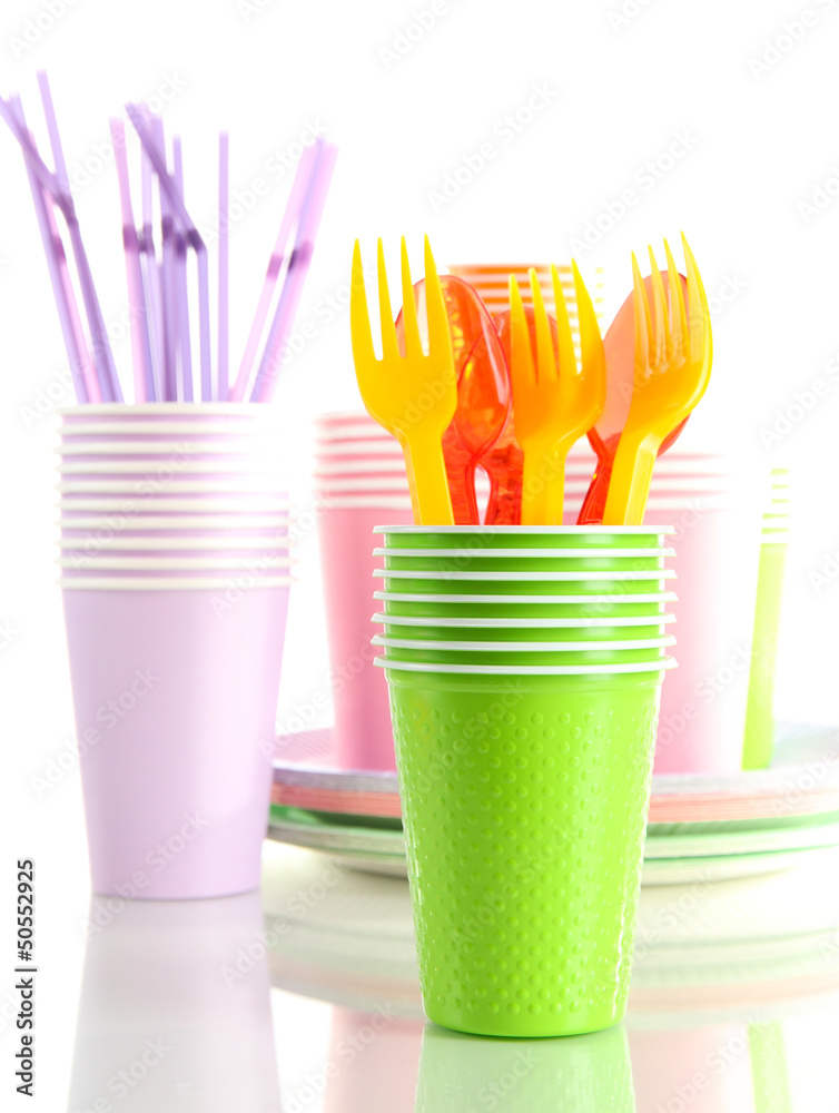 Multicolored plastic tableware isolated on white Multicolored plastic tableware isolated on white