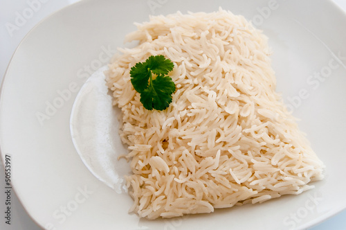 Cooked rice on a white plate