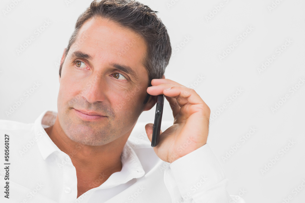 Man phoning and looking away Man phoning and looking away