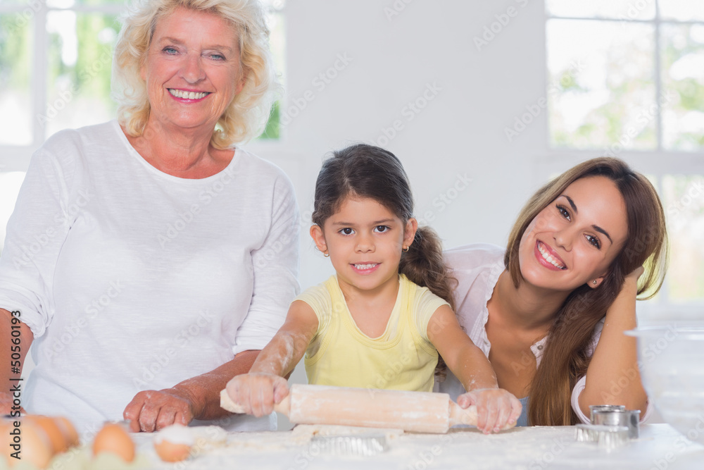 Happy women of a family baking together Happy women of a family baking together