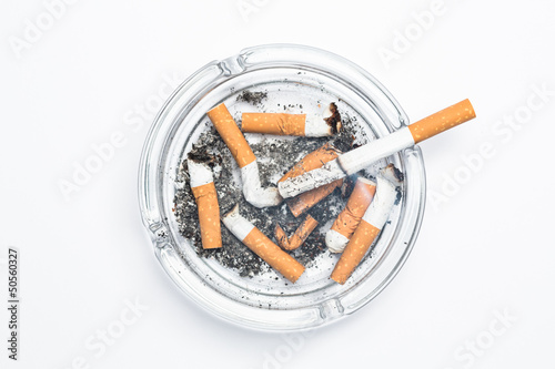 Overhead of burning cigarette in ashtray photo