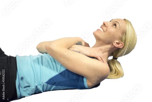 Middle age woman working on abs, isolated white background