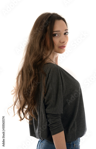 beautiful young woman posing in studio on white background