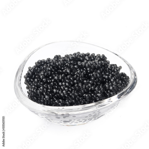 black caviar in a glass bowl isolated on a white background