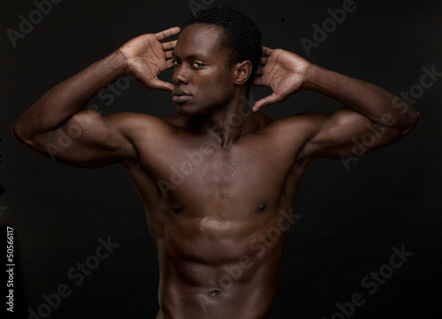 Athletic African American Man with Hands to Head