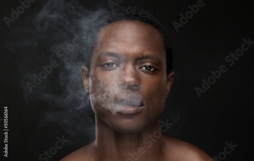 African American Man with Smoke Out of Mouth