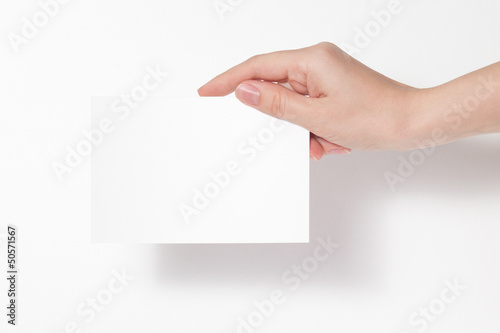 карточка в руках на белом фоне