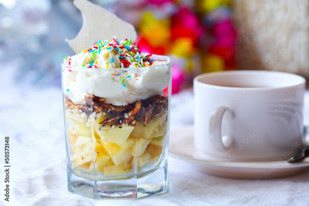 Fruit dessert with colorful sprinkles & cup of tea Fruit dessert with colorful sprinkles & cup of tea