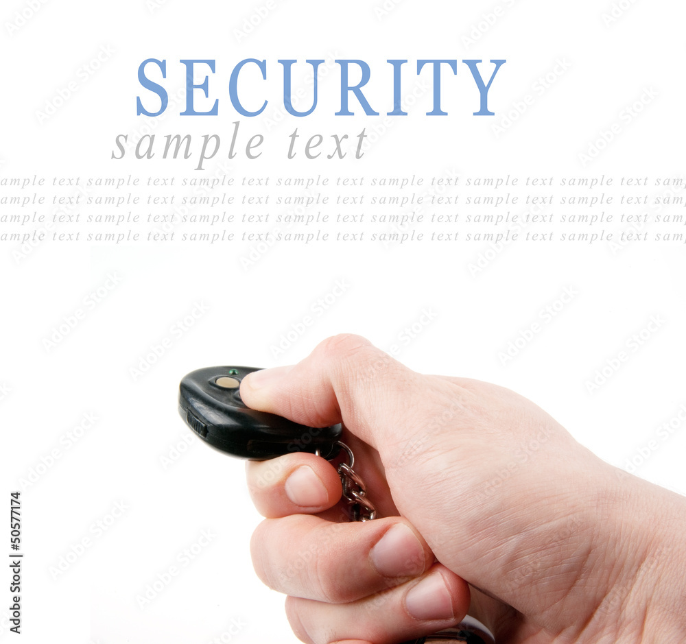 Hand holding remote control (car keys) isolated on white Hand holding remote control (car keys) isolated on white