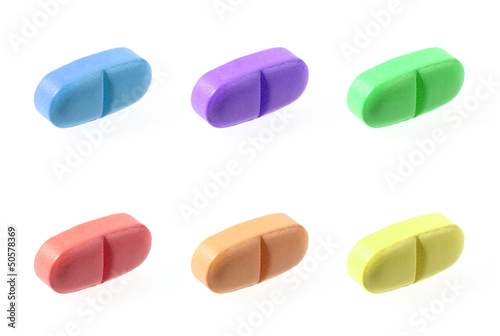 Color pills isolated on white background