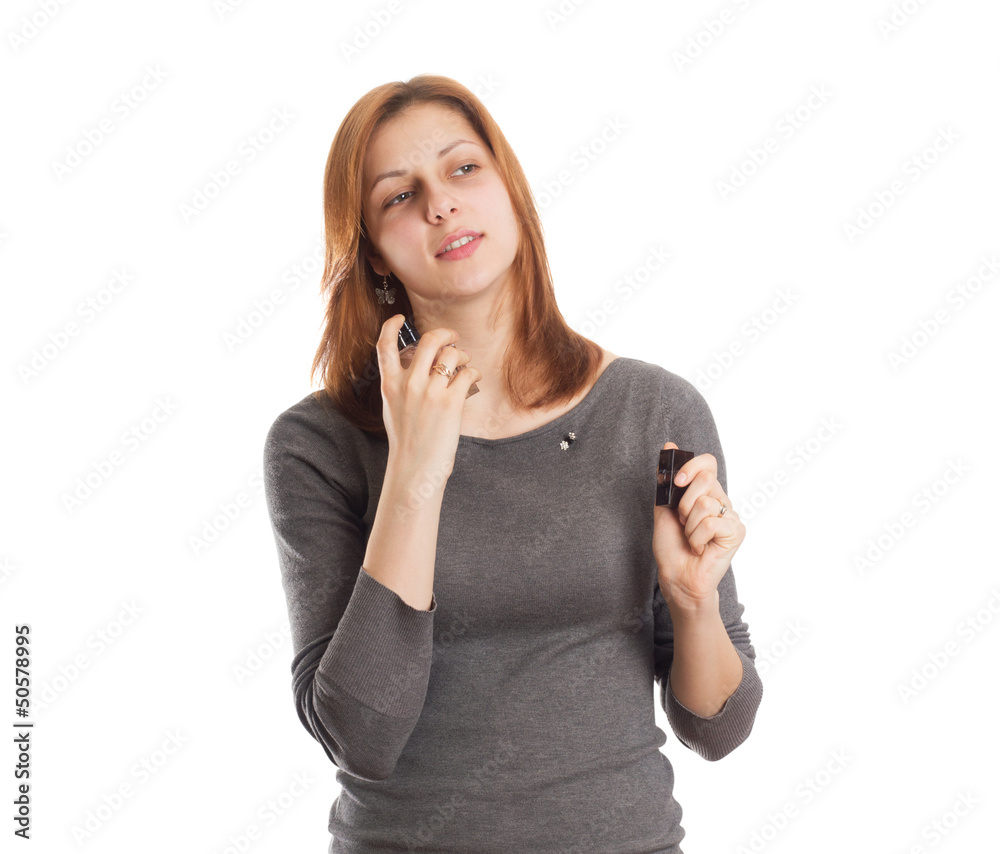 Fototapeta premium nice girl squirting perfume on her neck