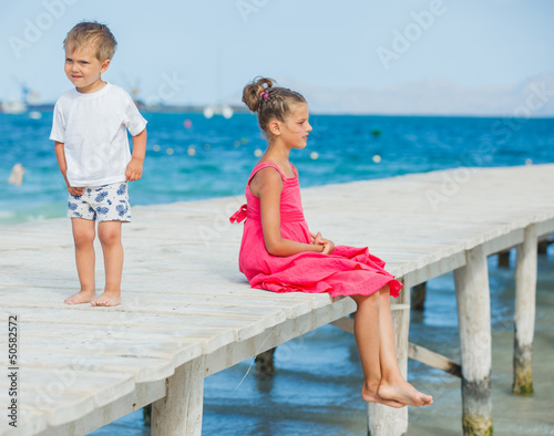 Kids walking on jetty