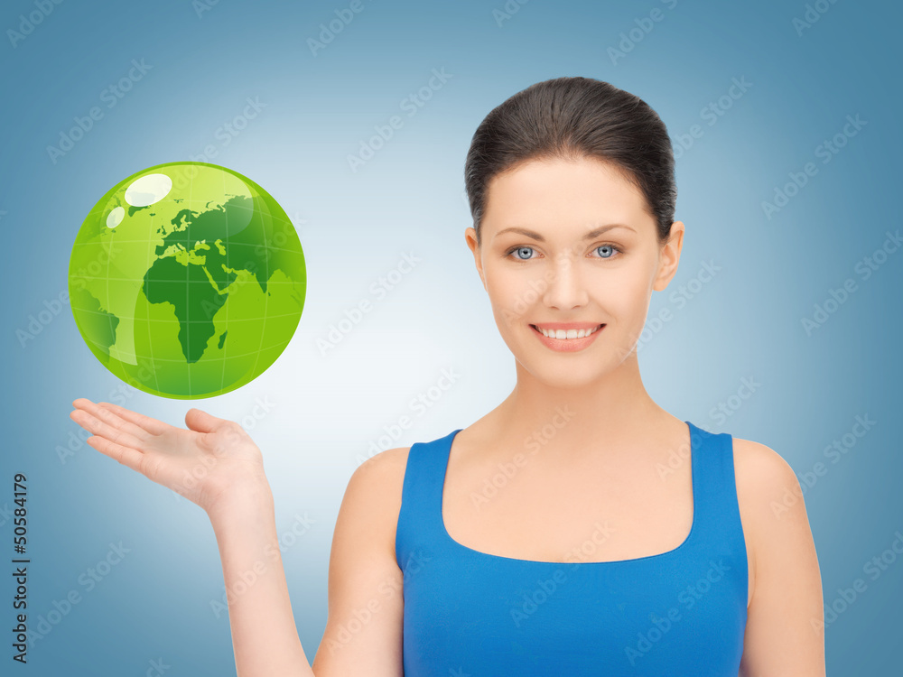 woman holding green globe on her hand woman holding green globe on her hand