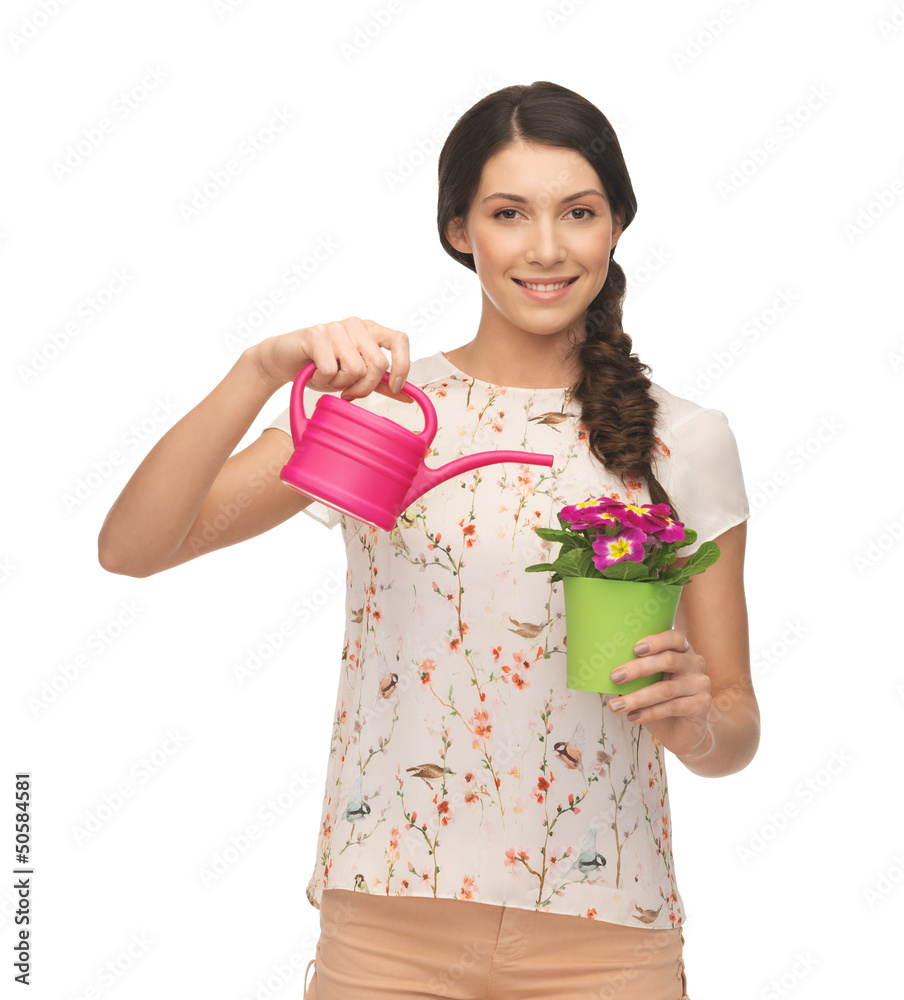housewife with flower in pot and watering can housewife with flower in pot and watering can