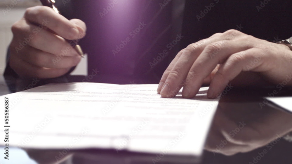 Businessman signing a contract Businessman signing a contract