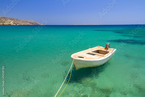 Boat on the blue lagoon of Vai beach, Crete