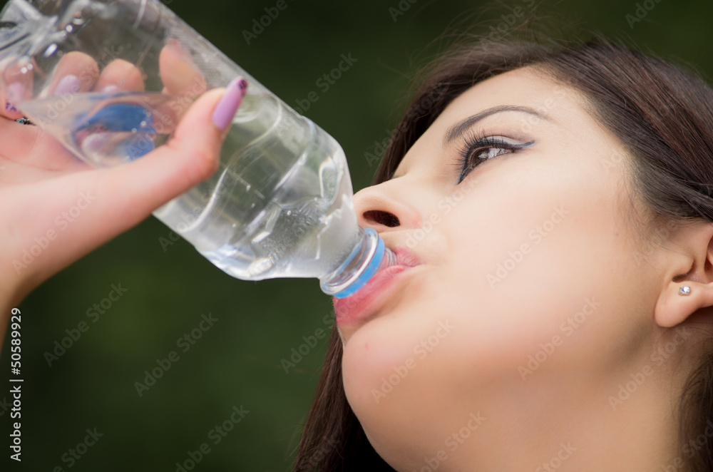 Portrait of woman drinking water outdoor Portrait of woman drinking water outdoor