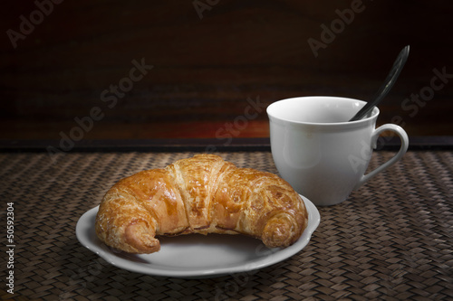 croissant and coffee cup