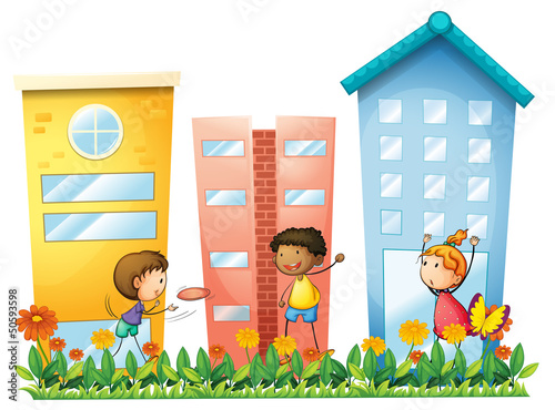 Kids playing in front of the high buildings