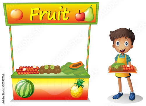 A young boy selling fruits
