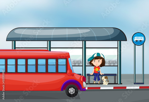 A lady with her pet at the waiting shed