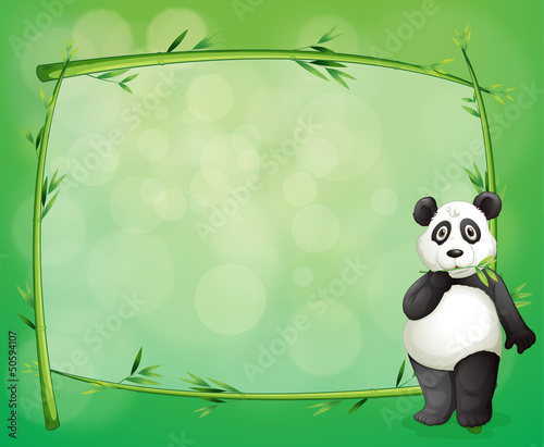 Fototapeta Naklejka Na Ścianę i Meble -  A panda beside a frame made of bamboo