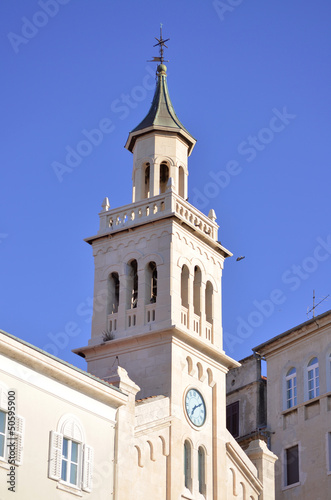 yelllow church tower in rijeka photo