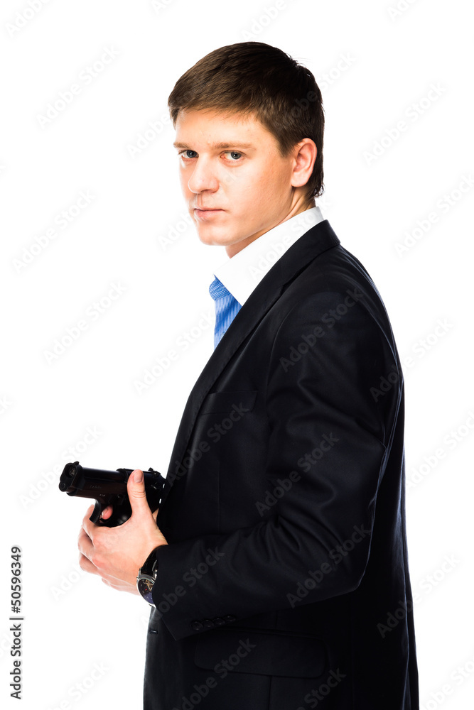 young and handsome man with a gun in his hand young and handsome man with a gun in his hand