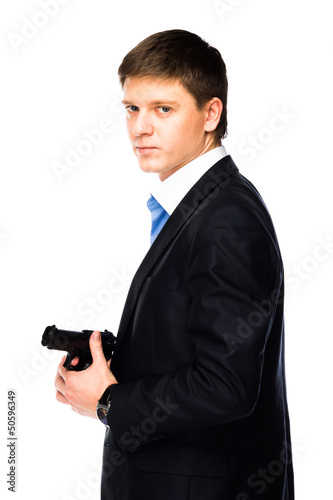 young and handsome man with a gun in his hand