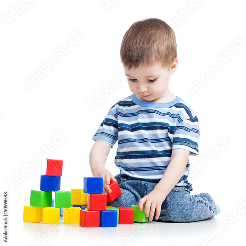 kid boy playing with colorf...