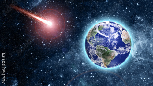 Fototapeta Naklejka Na Ścianę i Meble -  comet coming to blue planet in space