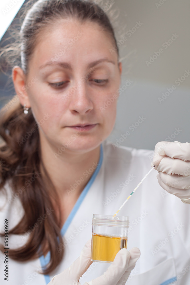 Woman making urine test