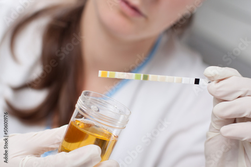 Woman making urine test photo